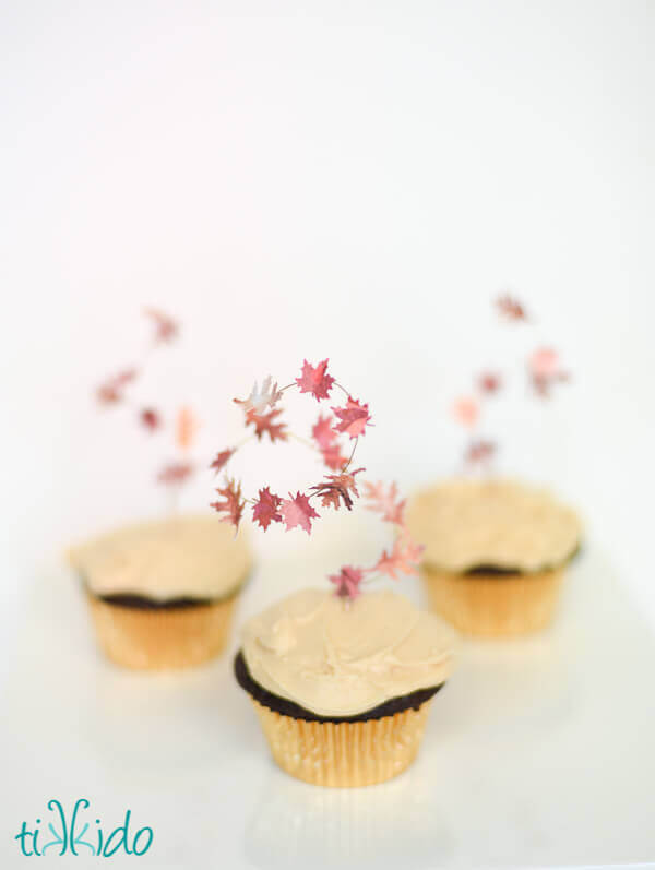 Fall leaf cupcake toppers look like leaves swirling in an autumn gust of wind.