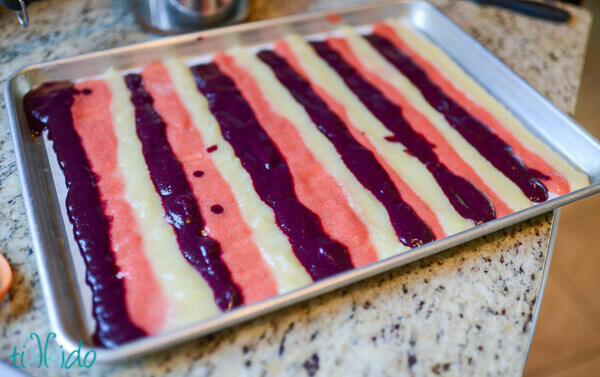 Fruit puree spread in baking pan ready to dehydrate into homemade fruit roll ups.