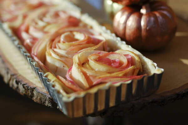 Rose apple pie made with with thinly sliced apples arranged into rose shapes.