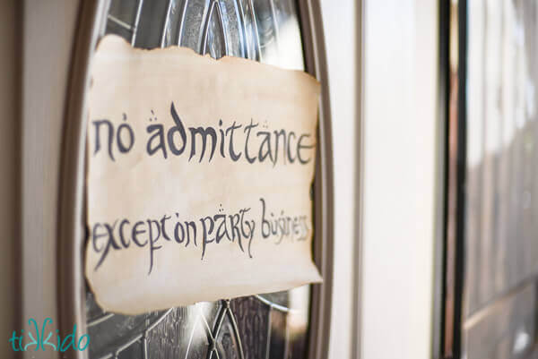 Sign at the Lord of the Rings birthday party saying "No admittance except on party business"