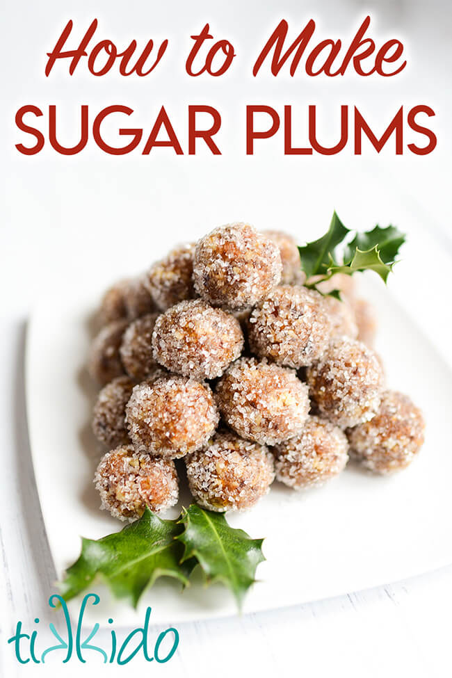 Sugar Plums Sugar plums stacked in a pyramid on a white plate decorated with fresh holly leaves, with text overlay reading "How to Make Sugar Plums."