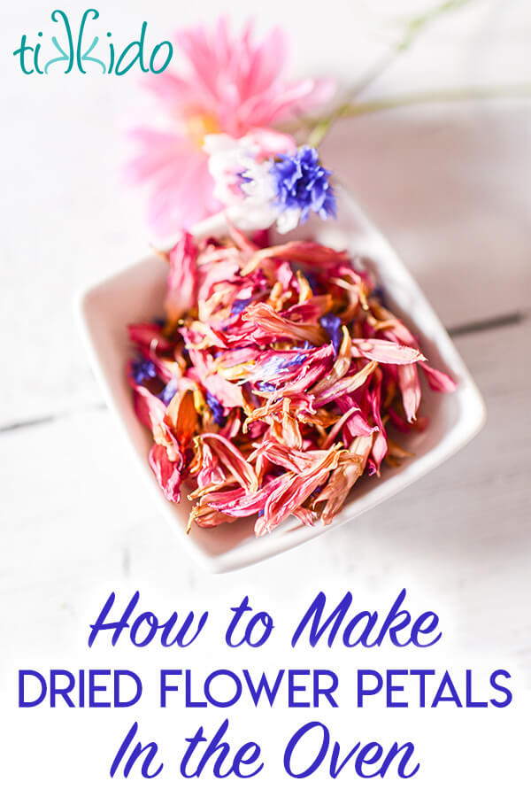 edible dried flower petals Square white bowl filled with dried pink and blue edible flower petals, with text overlay reading "How to Make Dried Flower Petals in the Oven."