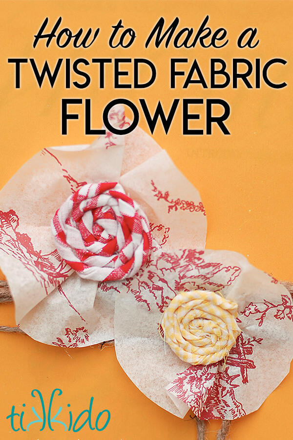 Twisted Fabric Flower Two twisted fabric flowers made with red and yellow print fabric, on a yellow background, with text overlay reading "How to Make a Twisted Fabric Flower."
