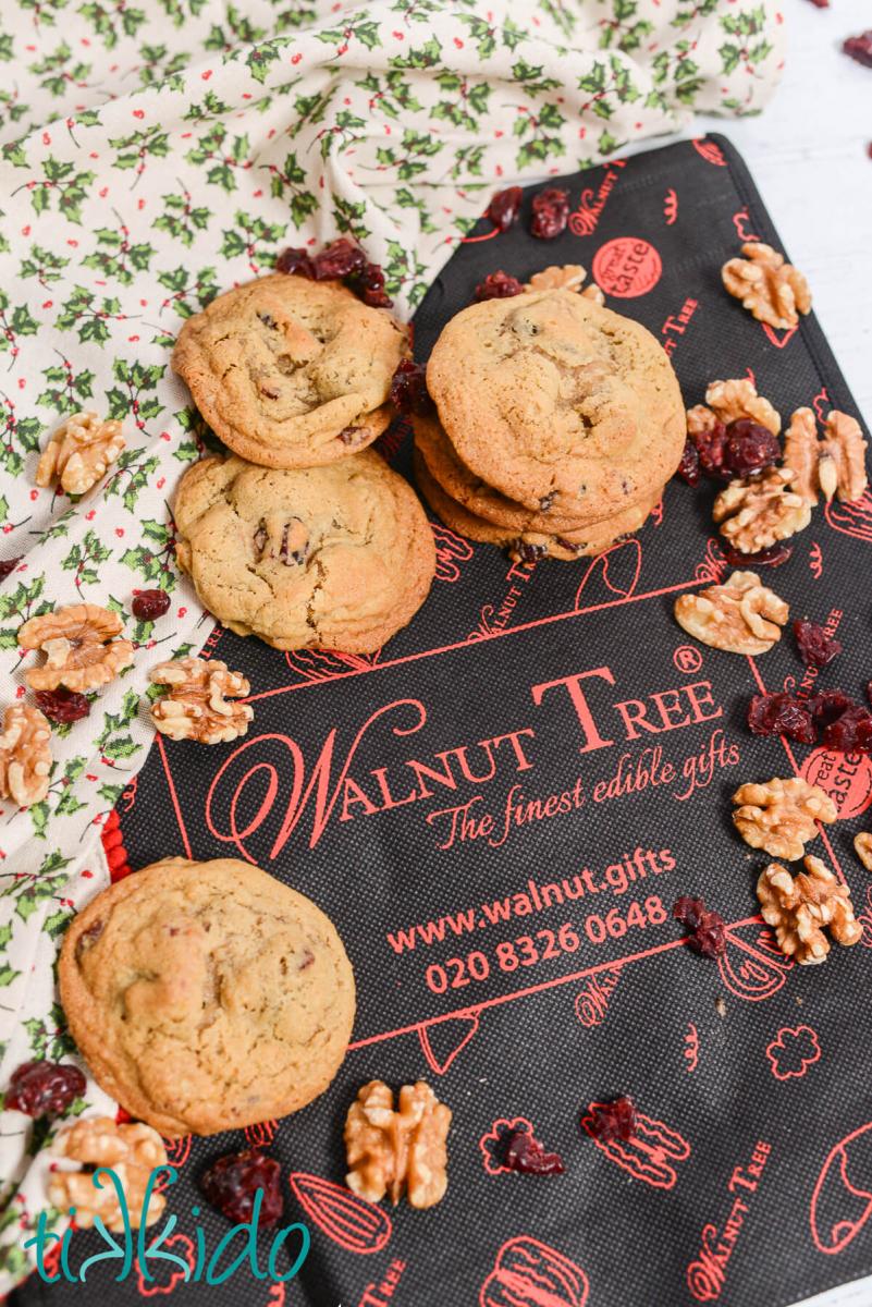 Cranberry Walnut Cookies Cranberry Walnut Cookies, walnuts, and dried cranberries scattered on a bag from Walnut Tree Gifts.