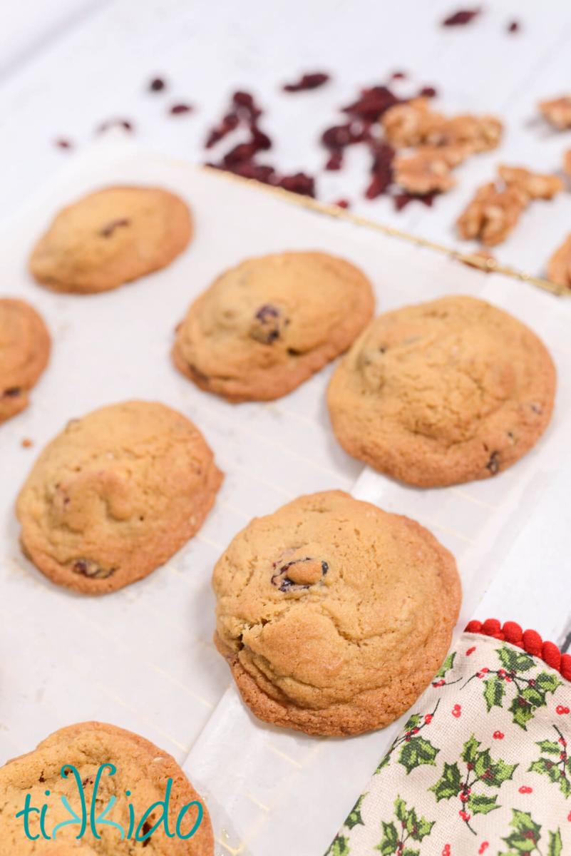 Cranberry Walnut Cookies Freshly baked Cranberry Walnut Cookies cooling on parchment paper on a wire cooling rack.