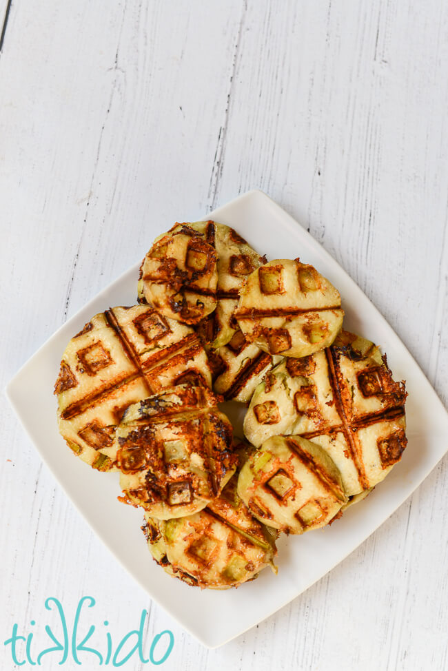Eggplant Parmesan Recipe Healthy Slices of healthy eggplant parmesan made in a waffle iron on a square white plate, on a white wooden surface.