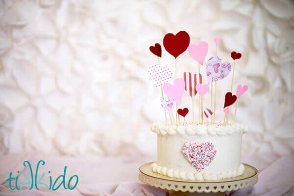 Valentine's Day Cake Topper Cake decorated with an easy Valentine's Day Cake Topper made from paper hearts and bamboo skewers.