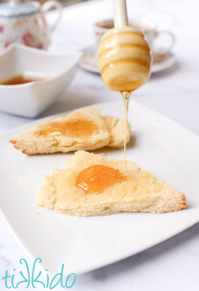 Easy Scones Recipe honey being drizzled on scones made with an easy scones recipe.