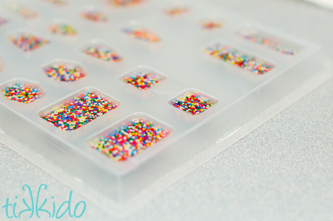 Resin Jewelry Resin cabochons filled with real sprinkles being made to make sprinkle resin jewelry