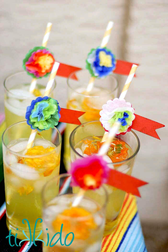 Colorful Mexican style miniature tissue paper flowers decorating straws