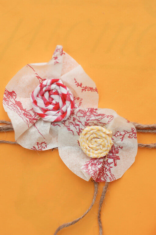 Twisted Fabric Flowers Twisted fabric flowers used as a gift topper on a gift at the Gnome birthday party.