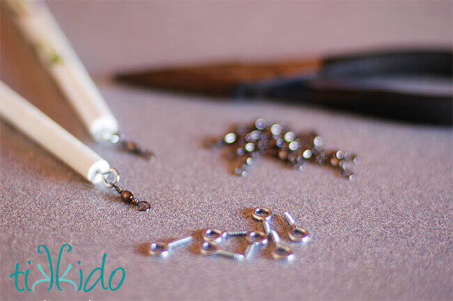 How to Make a Ribbon Wand Fishing swivels being attached to the end of a wooden dowel to make a ribbon wand.