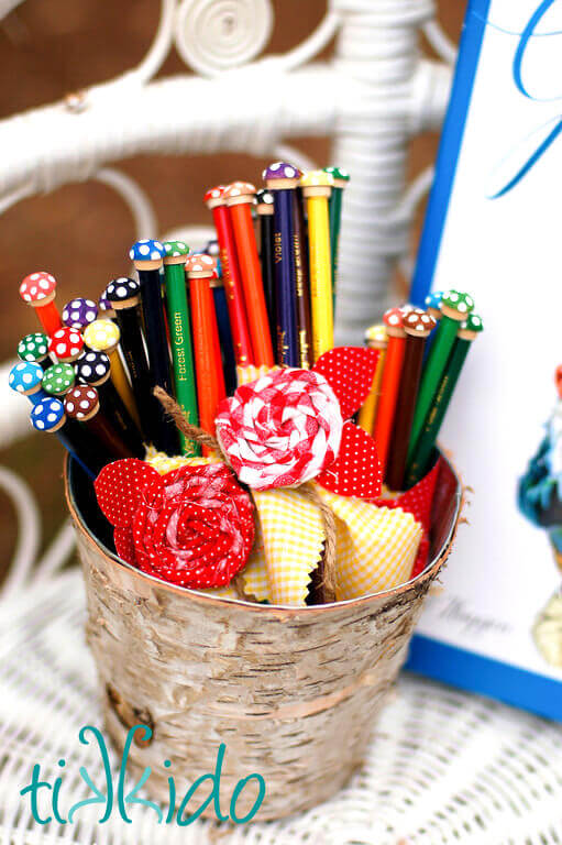 Twisted Fabric Flowers Twisted fabric roses decorating colored pencil favors at a Gnome birthday party.